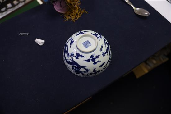 A Chinese blue and white dragon bowl, Qianlong seal mark and period (1736-95), D. 14.7cm, faults